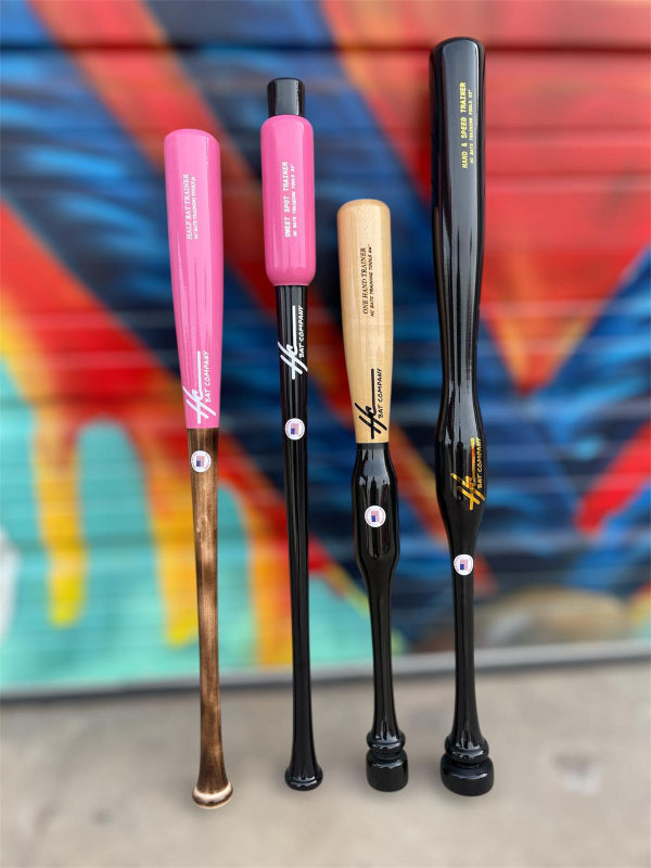 Four baseball bats with different colored handles against a colorful abstract background