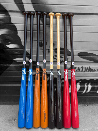 A selection of wooden baseball bats in various colors, aligned in a row with the HC Pro Fungo 35" bat in the center.