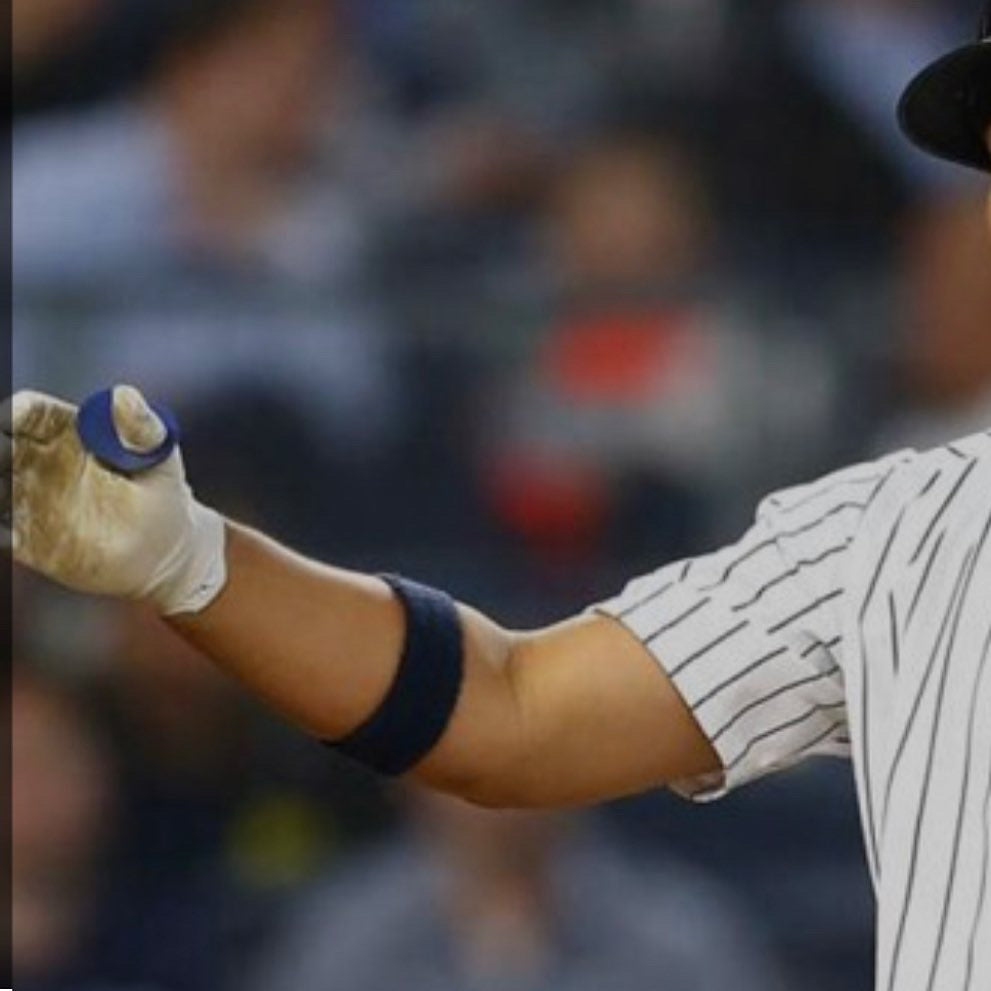 player using baseball thumb guard for bat sting protection and better grip