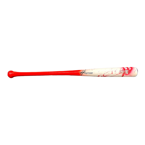 A wooden baseball bat with a red handle and white barrel, featuring red splatter graphics near the bottom.